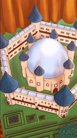 A castle with sunlight shining down on it.